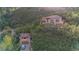 Stunning hillside home with private garage nestled amongst mature trees and lush mountain landscape at 10592 Raven Run, Littleton, CO 80125