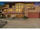 Expansive home exterior featuring multiple windows, balconies, and a red tiled roof at 10592 Raven Run, Littleton, CO 80125