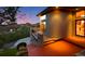 Modern home with a balcony showcasing steps leading to the entrance and scenic views at 10592 Raven Run, Littleton, CO 80125