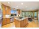 Beautiful kitchen featuring a center island, granite counters and lots of cabinet space at 10592 Raven Run, Littleton, CO 80125
