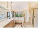 Main bathroom features dual sinks, a large soaking tub, and a glass shower, providing a spa-like experience at 10592 Raven Run, Littleton, CO 80125