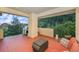 Outdoor patio with seating area and grill showcasing lush green surroundings at 10592 Raven Run, Littleton, CO 80125