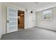 Finished basement with neutral carpet and direct access to the laundry area at 2709 S Franklin St, Denver, CO 80210