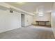 Finished basement with neutral carpet and a window letting in natural light at 2709 S Franklin St, Denver, CO 80210