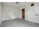 Finished basement with neutral carpet and two closets at 2709 S Franklin St, Denver, CO 80210