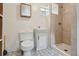 Finished basement bathroom with a tiled shower and a modern vanity at 2709 S Franklin St, Denver, CO 80210