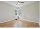 This empty bedroom offers hardwood floors and a corner window at 2709 S Franklin St, Denver, CO 80210