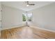 This is a picture of an empty bedroom with hardwood floors and a corner window at 2709 S Franklin St, Denver, CO 80210
