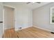 Bright bedroom featuring hardwood floors, neutral paint, and a ceiling fan at 2709 S Franklin St, Denver, CO 80210