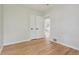 Bedroom with hardwood floors, closet with white doors, and neutral paint at 2709 S Franklin St, Denver, CO 80210
