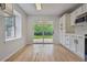 Eat in kitchen with sliding glass door to the backyard, providing ample natural light at 2709 S Franklin St, Denver, CO 80210