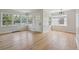 Bright and airy living room featuring hardwood floors, large windows, and neutral paint at 2709 S Franklin St, Denver, CO 80210