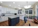 Bright kitchen with white cabinets, subway tile backsplash, and a blue center island with granite countertops at 87 Canongate Ln, Highlands Ranch, CO 80130