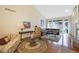 Bright living room featuring hardwood floors, a comfortable sectional sofa, and a decorative rug at 87 Canongate Ln, Highlands Ranch, CO 80130