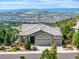 Stunning exterior of home with lush landscaping, mountain views and a large three car garage at 416 Galaxy Dr, Castle Rock, CO 80108