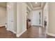 Bright and airy foyer featuring hardwood floors, elegant lighting, and a welcoming front door at 416 Galaxy Dr, Castle Rock, CO 80108