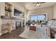 Inviting living room with stone fireplace, large windows showcasing an unobstructed view of the hills at 416 Galaxy Dr, Castle Rock, CO 80108