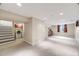 Spacious finished basement featuring neutral carpeting, recessed lighting, and a laundry area at 245 Main St, Broomfield, CO 80020