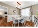 Charming dining room featuring hardwood floors, a modern light fixture, and ample natural light at 245 Main St, Broomfield, CO 80020