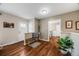 Bright and open foyer with hardwood floors, a hall tree, and neutral paint at 245 Main St, Broomfield, CO 80020