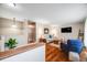 Bright living room featuring wood floors, neutral paint, comfortable seating, and lots of natural light at 245 Main St, Broomfield, CO 80020