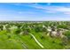 Picturesque park featuring walking paths, lush greenery, and a creek, perfect for relaxation and recreation at 245 Main St, Broomfield, CO 80020