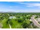 Scenic park with lush greenery, mature trees, walking paths, and recreational areas for the whole Gathering at 245 Main St, Broomfield, CO 80020
