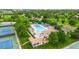 Community outdoor pool with lounge chairs, a playground, and mature trees, creating a relaxing atmosphere at 245 Main St, Broomfield, CO 80020