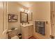 Well-lit bathroom with a vanity and framed mirror, providing a clean and functional space at 7945 York St # 2, Denver, CO 80229