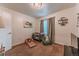 Cozy bedroom with plush carpet, crib, and a comfy chair perfect for a Bedroom or guest room at 7945 York St # 2, Denver, CO 80229