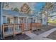 Charming home exterior with a cozy wooden deck and well-maintained walkway to the front door at 7945 York St # 2, Denver, CO 80229