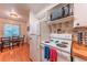 Functional kitchen area with essential appliances and an adjacent dining space, providing convenience for meal preparation at 7945 York St # 2, Denver, CO 80229