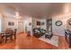 Inviting living room with hardwood floors, comfortable seating, and a dining area, creating a welcoming space at 7945 York St # 2, Denver, CO 80229