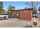 Backyard featuring a shed, patio, and a combination of gravel and concrete areas at 8375 W 17Th W Ave, Lakewood, CO 80214