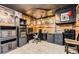 Finished basement featuring vinyl floors, dark trim, a workstation, and recessed ceiling lighting at 8375 W 17Th W Ave, Lakewood, CO 80214