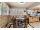 Cozy dining area featuring a dining table with chairs and brick accent wall at 8375 W 17Th W Ave, Lakewood, CO 80214