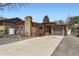 Charming brick home with a spacious driveway and attached garage at 8375 W 17Th W Ave, Lakewood, CO 80214