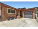 Charming brick home with a spacious driveway and attached garage at 8375 W 17Th W Ave, Lakewood, CO 80214