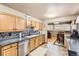 Modern kitchen boasts stainless steel appliances and a stylish tile backsplash at 8375 W 17Th W Ave, Lakewood, CO 80214