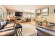 Cozy living room features a fireplace, tv, hardwood floors, and comfortable leather sofas at 8375 W 17Th W Ave, Lakewood, CO 80214