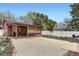 Backyard featuring a covered patio with seating, shed and gravel areas at 8375 W 17Th W Ave, Lakewood, CO 80214