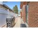A view of the home's side yard with privacy fence and landscaped walkway at 8375 W 17Th W Ave, Lakewood, CO 80214