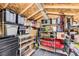 Well-organized storage shed with shelving and overhead lighting provides lots of space for storing your extras at 8375 W 17Th W Ave, Lakewood, CO 80214