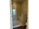 Modern bathroom with a glass shower enclosure and built-in bench seating at 2383 S Troy Ct, Aurora, CO 80014