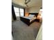 Bright bedroom featuring a ceiling fan, bedside lamps, and windows at 2383 S Troy Ct, Aurora, CO 80014