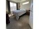 Bright bedroom with natural light, soft carpet, and neutral paint scheme at 2383 S Troy Ct, Aurora, CO 80014