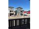 Stunning exterior view of modern townhomes with balconies and well-maintained landscaping at 2383 S Troy Ct, Aurora, CO 80014