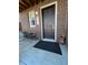 Charming front porch with brick facade and cozy seating area for relaxing at 2383 S Troy Ct, Aurora, CO 80014