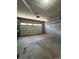 Spacious two car garage with concrete floor and insulated garage door at 2383 S Troy Ct, Aurora, CO 80014