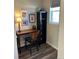 Cozy home office features a desk, chair, shelving unit, and natural light from the window at 2383 S Troy Ct, Aurora, CO 80014